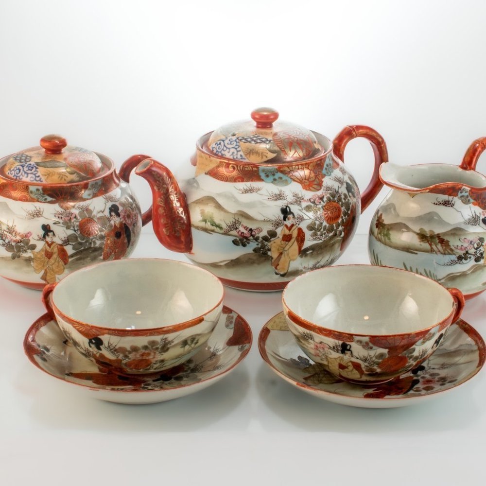 Hand-Painted Porcelain Tea Set with Red and Cream Accents